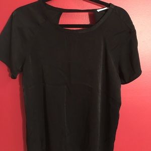 Brand new black blouse with cut out back